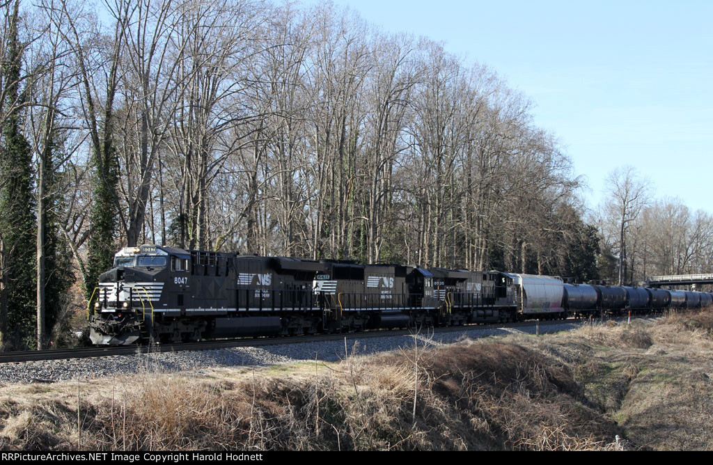 NS 8047 leads ethanol train 64D eastbound